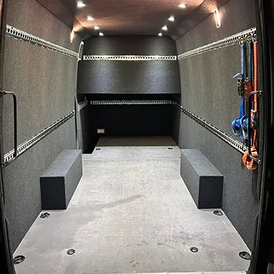 The inside of a vehicle with the door open.