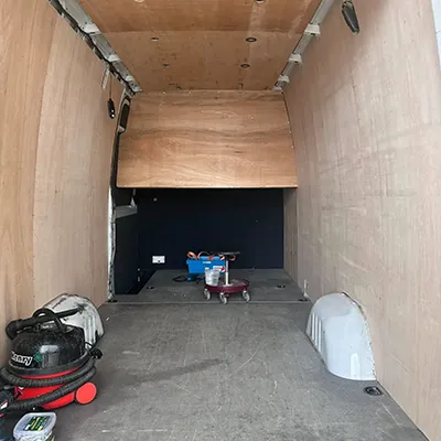 The inside of a truck with the door open.