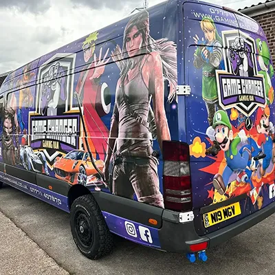A van with a picture of a woman on the side of it.