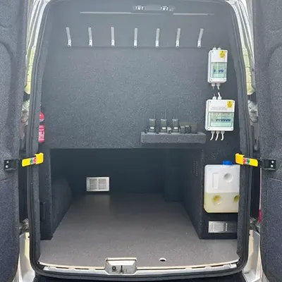 The back end of a van with its doors open.