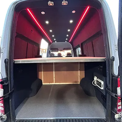 The back end of a van with the door open.